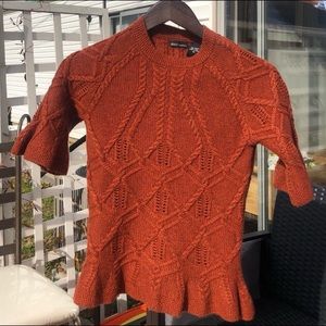 Ruffle hem and sleeve sweater